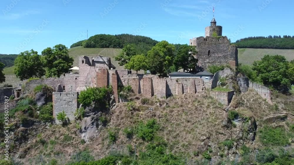 Aerial backwards flight showing famous saarburg castle architecture on beautiful day Aerial backwards flight showing famous saarburg castle architecture on beautiful day
