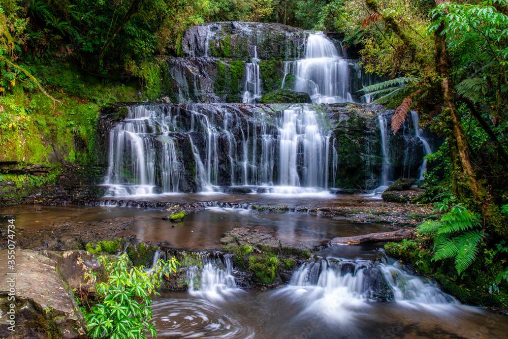 The Beautiful Purakaunui waterfall all in the lush dense native bush and forest of the Catlins in Southern New Zealand The Beautiful Purakaunui waterfall all in the lush dense native bush and forest of the Catlins in Southern New Zealand