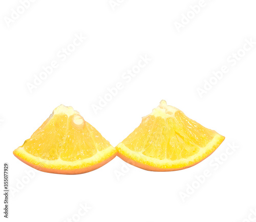 Two triangle slices of orange isolated on white background