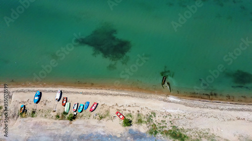 Aerial shot of fishing boats on the beach in Halkidiki Greece