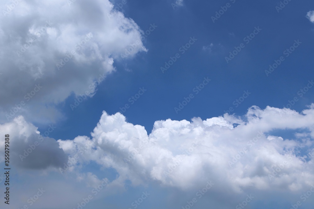 Blue skies and clouds backgrounds and textures closeup for wallpaper interior design. Blue skies and clouds backgrounds and textures closeup for wallpaper interior design.