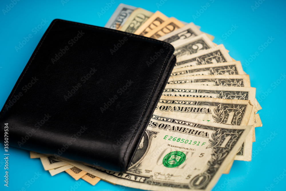 leather wallet with money on blue background leather wallet with money on blue background
