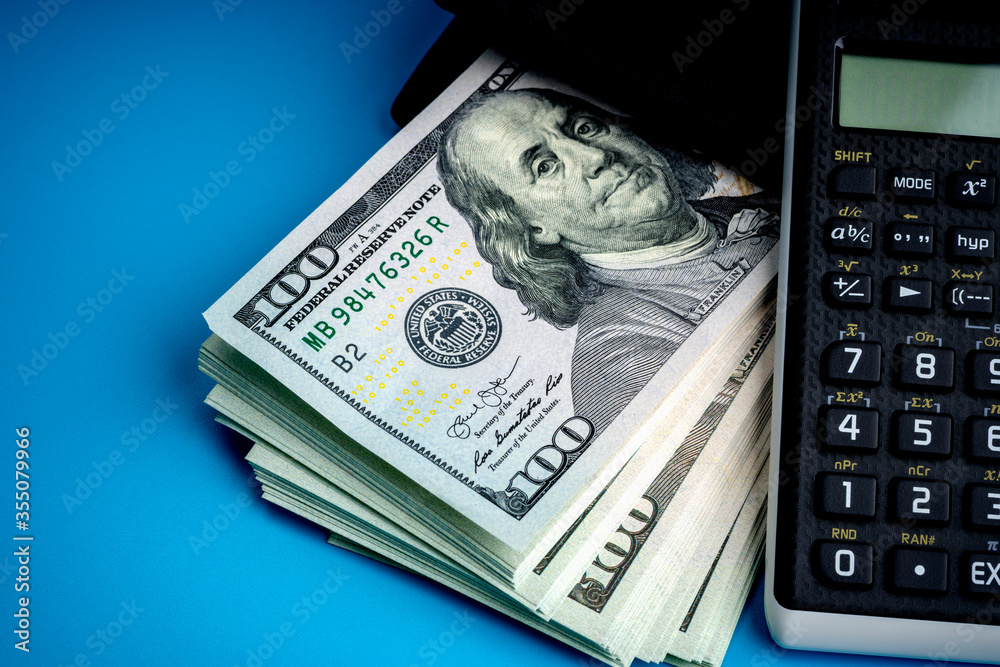 leather wallet with money on blue background leather wallet with money on blue background