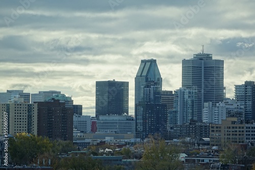 Close view of a few sky scrapers of Montreal's down town from a distance of Plateau district from high floor
