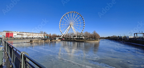 ferris wheel of Montreal with frozen pond around it