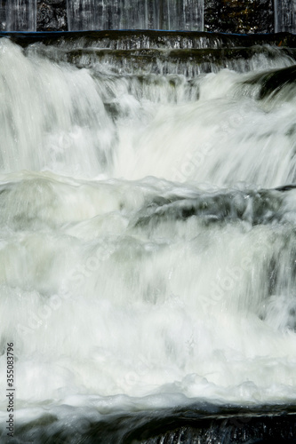 Broad Brook cascades over a waterfall in East Windsor, Connecticut.