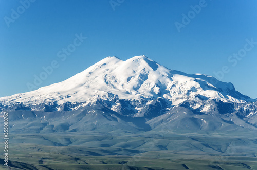 snow covered mountains. Elbrus  mountains in summer.