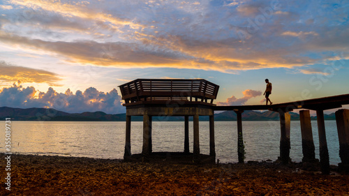 Jetty silhouette against beautiful sunset in Thailand