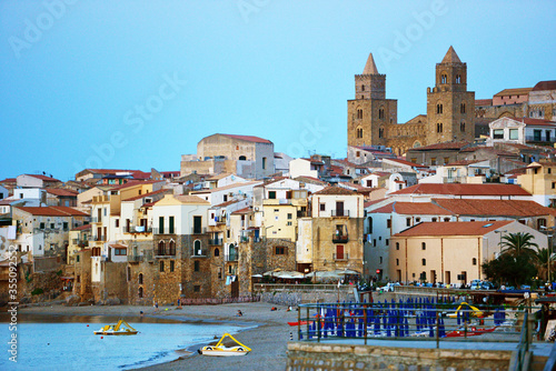 City beach of Cefalu, with the cathedral, Sicily
