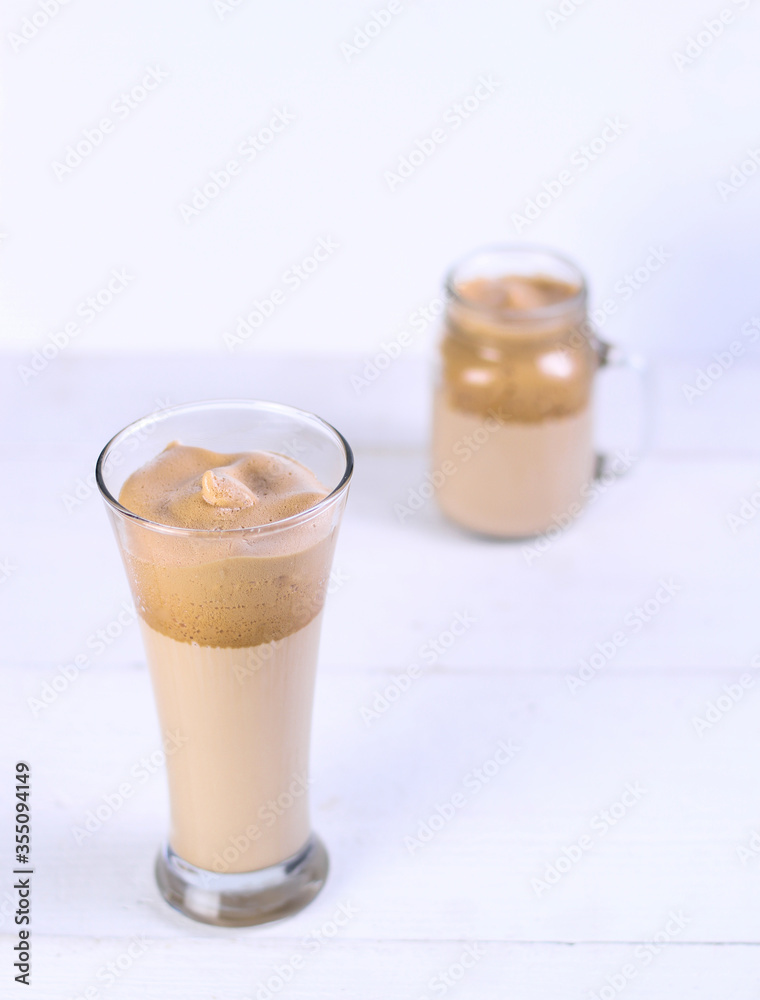 Two glass dalgona Coffee on white table Two glass dalgona Coffee on white table