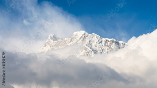 Annapurna III peak appearing behind the clouds, Annapurna Circuit, Nepal
