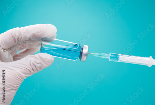 Injection syringe and vaccine vial. Vaccination of the population