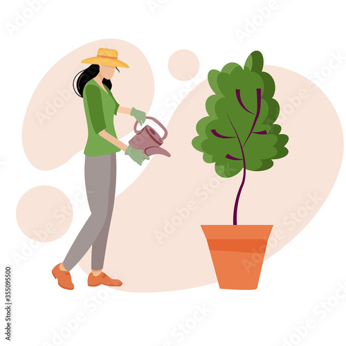 Garden A young girl with a watering can watered a green tree, a woman takes care of the garden, grows plants.