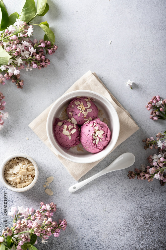lilac ice cream in a white bowl, view from above