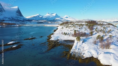 Landscapes of winter Norway. Coast. Ferry. Mountains and fjords in Norway in winter. Panoramic view. Aerial photography. Sunny winter day. Winter card. landscape.