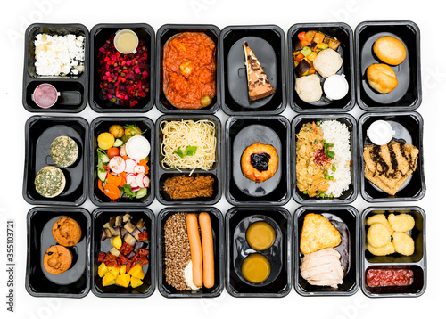 food in containers on a dark background. food delivery. healthy food. over view
