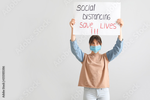 Young woman holding paper w...
