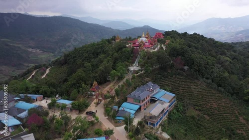 Aerial view of a remote Dai village in xishuangbanna, Yunnan - China photo