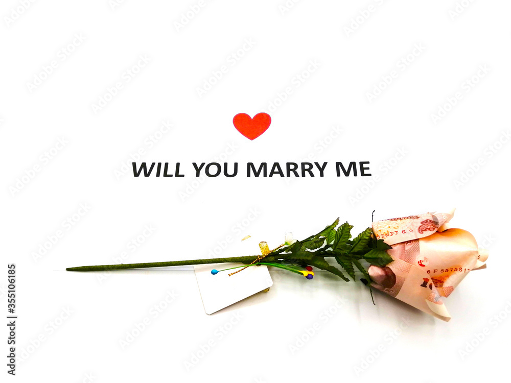 Note WILL YOU MARRY ME sentence words written on white paper with a
