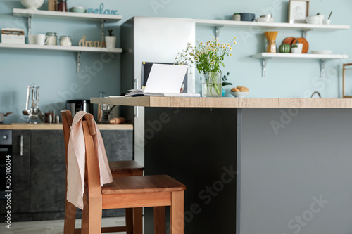 Stylish table in modern kitchen © Pixel-Shot