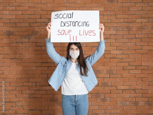 Young woman holding paper w...