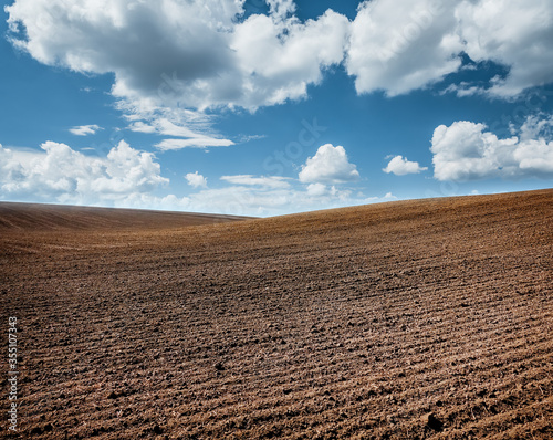 Picturesque rural area and plowed field on the springtime. photo