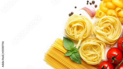 pasta, cherry tomatoes, spaghetti and garlic on a white background
