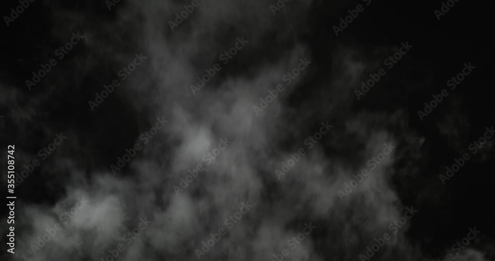 White Steam Ascends Over the Pan. White Steam rises from a large pot that is behind the scenes. Black background. White Steam Ascends Over the Pan. White Steam rises from a large pot that is behind the scenes. Black background.