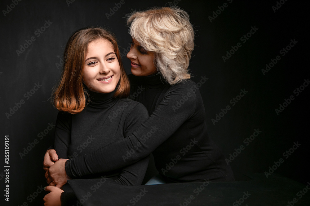 Joyful mother and daughter , hugging and enjoying Joyful mother and daughter , hugging and enjoying