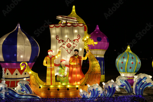 Chinese paper lantern in form of fairytale ship, sea. Night lights. Asian traditional national folk art. Oriental tradition. Symbol of China, asia and east. Ethnic decoration. Decor with lamp. Sadko photo