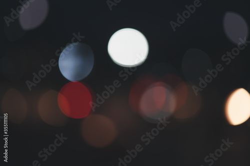 Car light background with blurred bokeh. © SEVENNINE_79