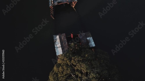 low drone flyover of shipwreck ss ayrfield parramatta river homebush sydney photo