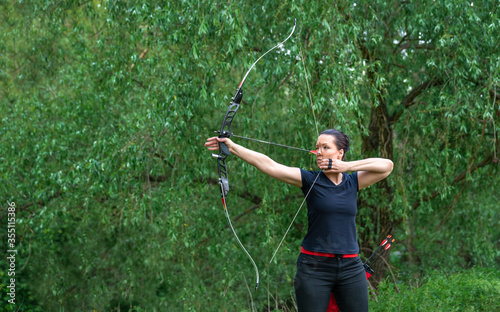 arrow shooting from a bow in nature, sport archery. copy space