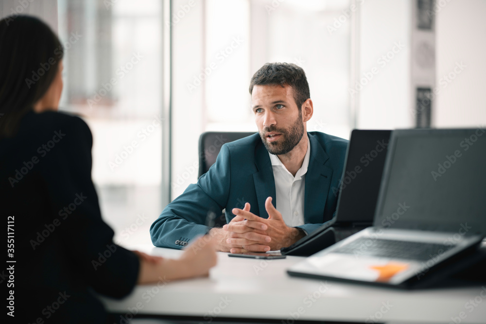 Businessman working on a project in the office. Young businessman working in office.