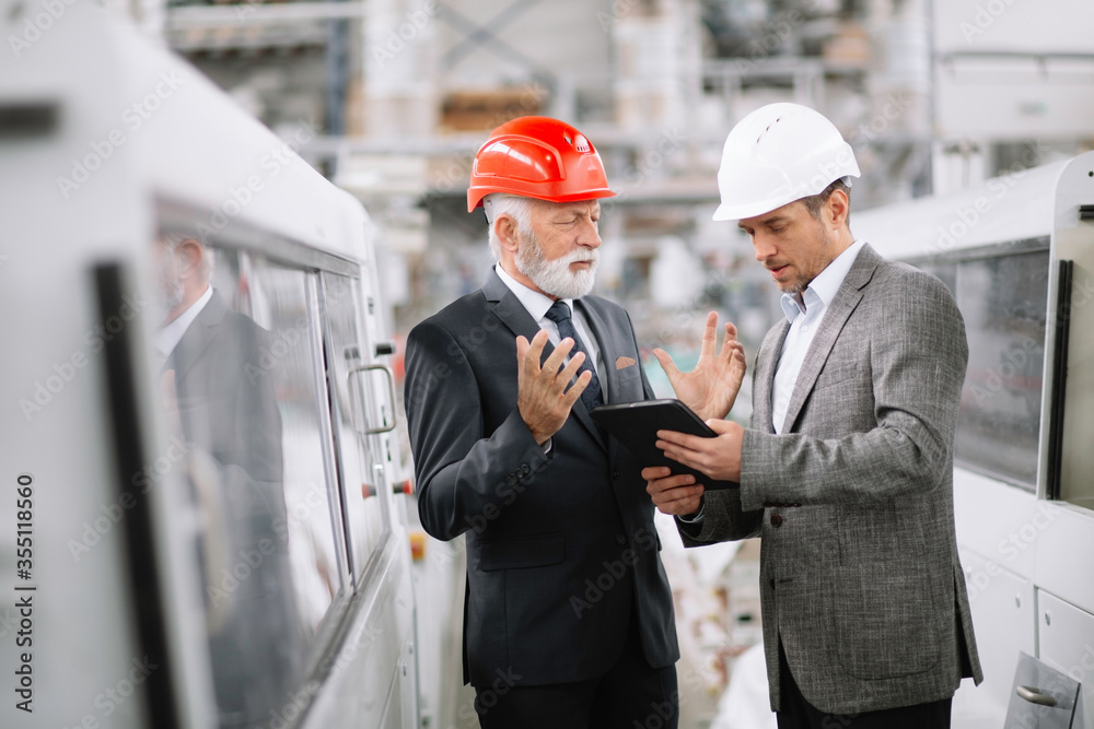 Colleagues working together. Arhitects in factory.
Colleagues working together. Arhitects in factory.