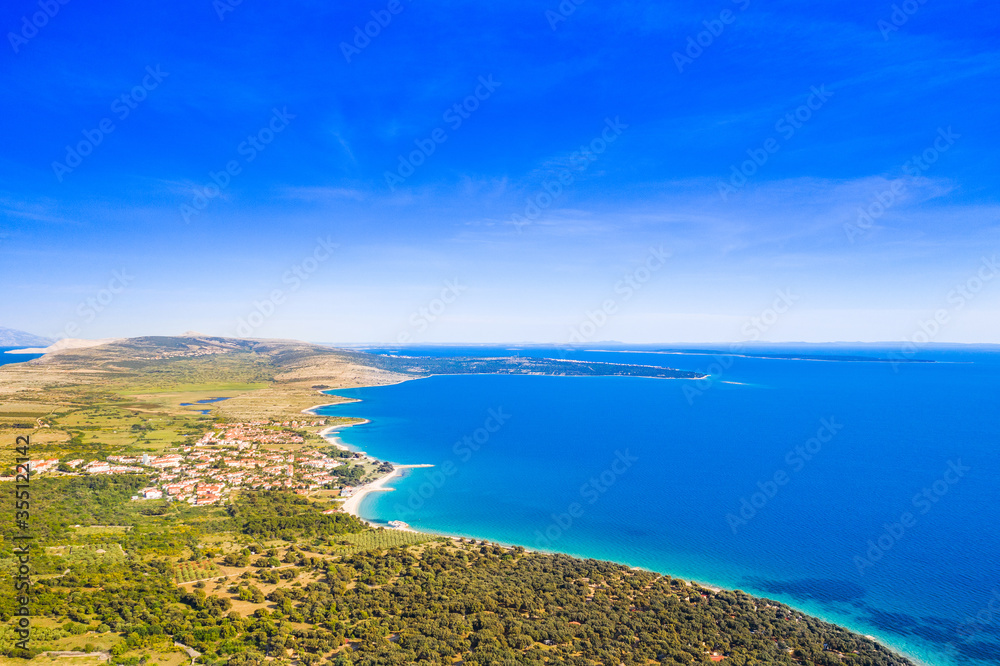 Croatia, green side of the island of Pag, agriculture fields and Adriatic sea coastline