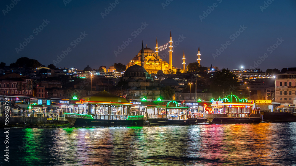 Night in Istanbul, Turkey with Suleymaniye Mosque (Ottoman imperial mosque). View from Galata Bridge in Istanbul