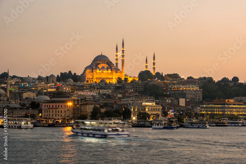 Sunset in Istanbul, Turkey with Suleymaniye Mosque (Ottoman imperial mosque). View from Galata Bridge in Istanbul.