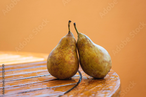 Фотография Pears intertwined on a wooden table after the rain
Conceptual of love, social d