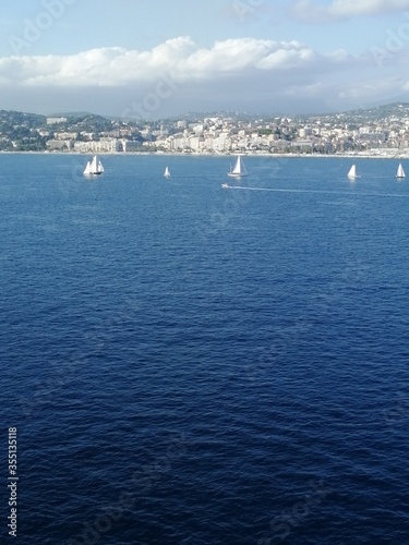 White yachts in the blue sea © Elena