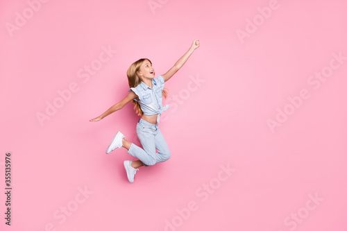 Full length body size view of her she nice attractive lovely pretty carefree ecstatic glad cheerful cheery preteen girl jumping having fun holiday isolated over pink pastel color background