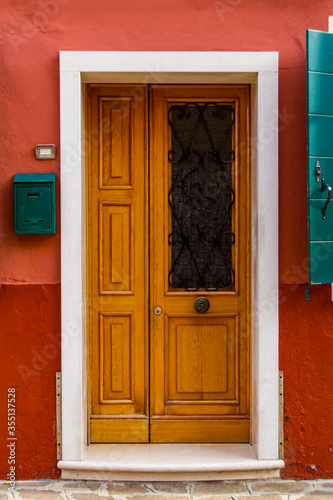 Old traditional door on col...