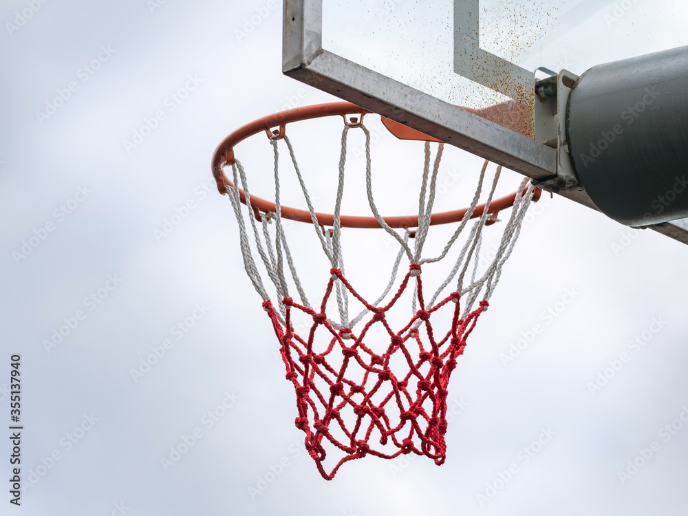 Naklejka premium Basketball ring with a net for playing basketball outdoors