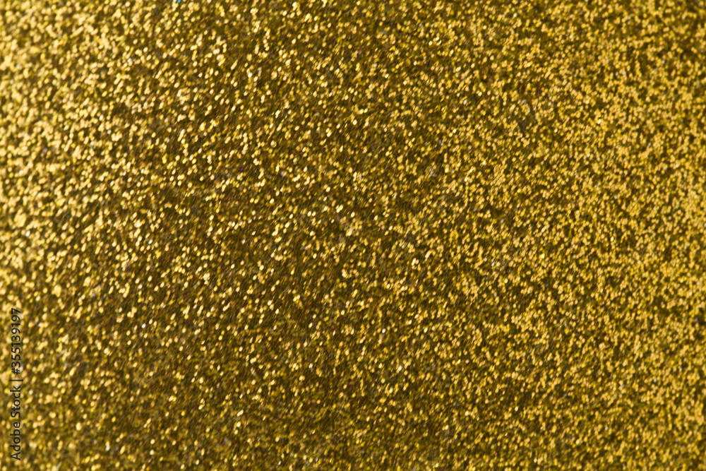 Texture of festive shiny golden background.
