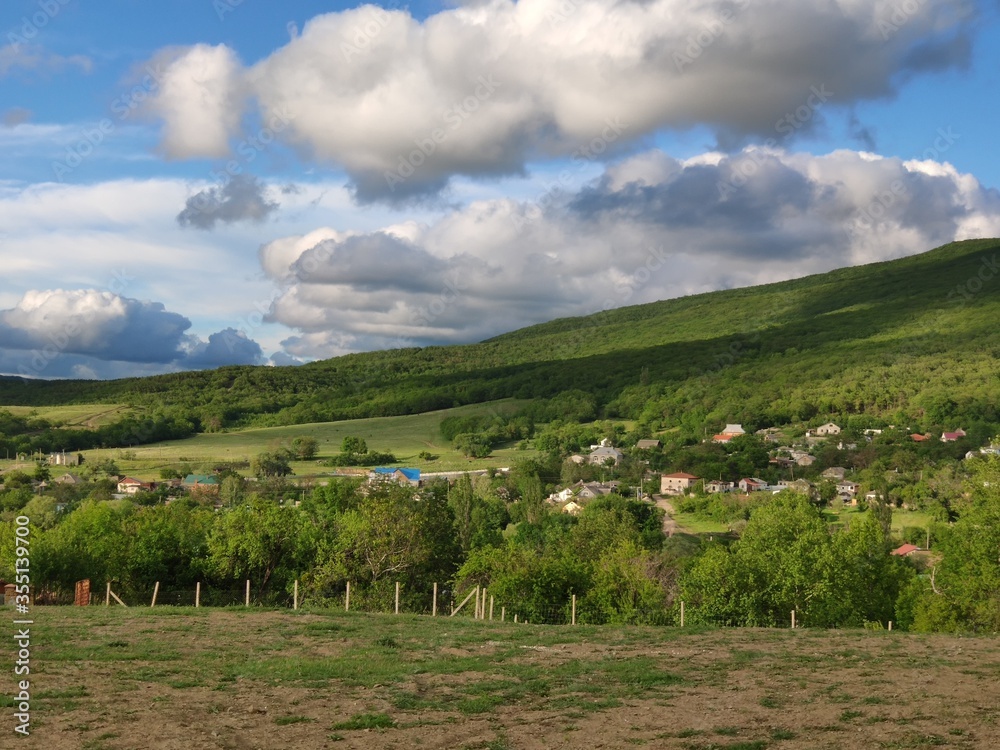 Summer landscape in the mountain Crimea on the Crimean peninsula with a view of the village