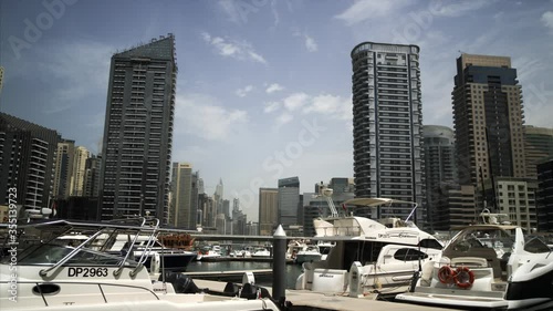 Dubai landscape of skyscrapers, yacht, boats bay water metropolis  photo