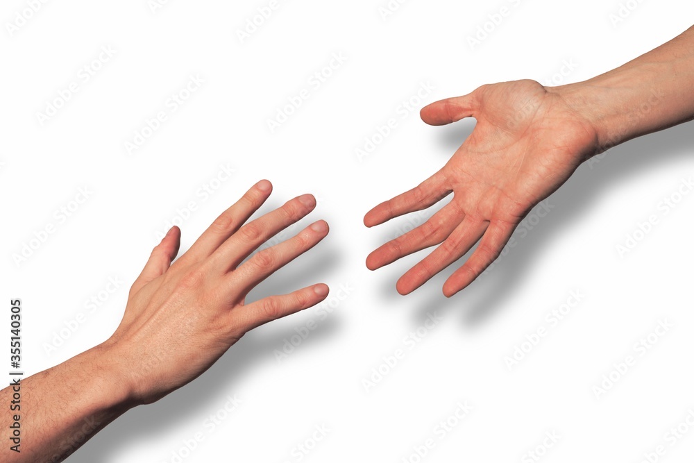 Hand reaching out offering help to another hand seeking help and rescue Hand reaching out offering help to another hand seeking help and rescue