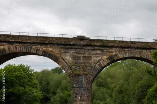 Obraz na płótnie The historic market town of Yarm, north Yorkshire showing the brick railway viaduct w salonie