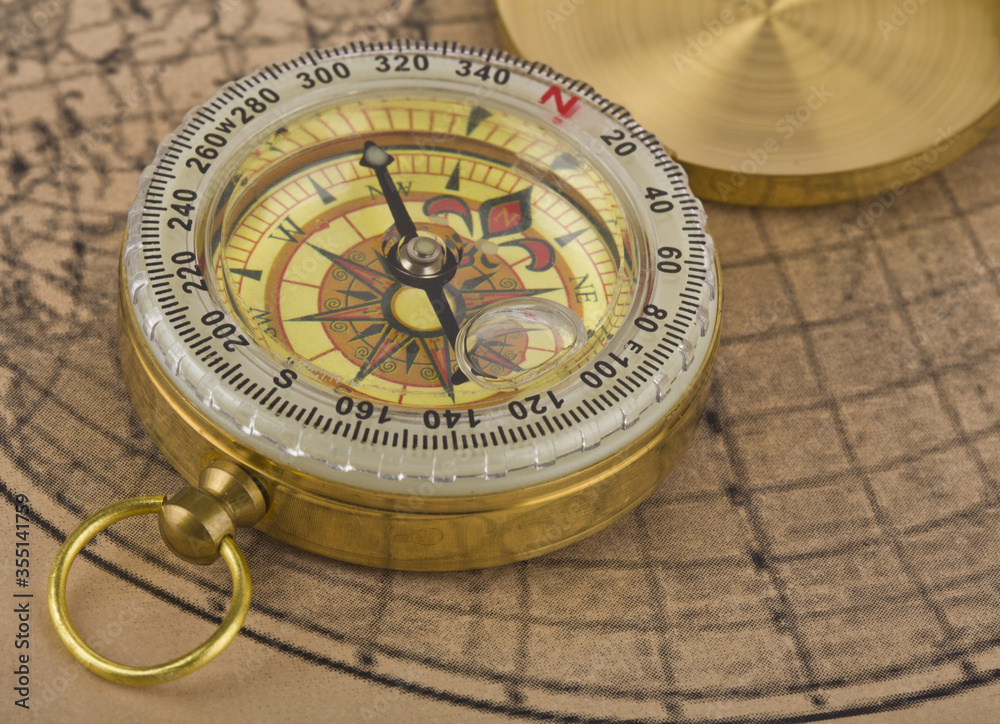 Compass on old paper as a background.