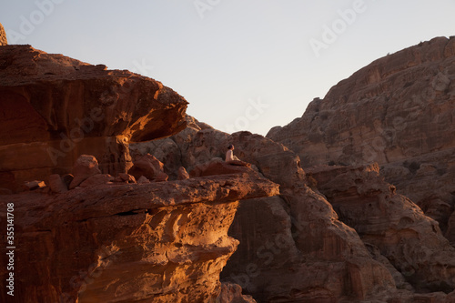 man sitting on mountains in a national park